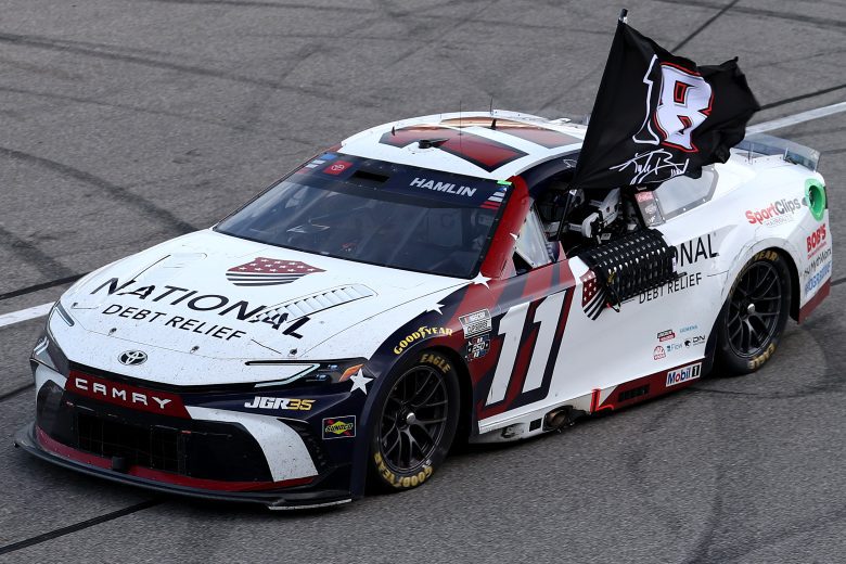 Denny Hamlin salutes Kyle Busch at Michigan.
