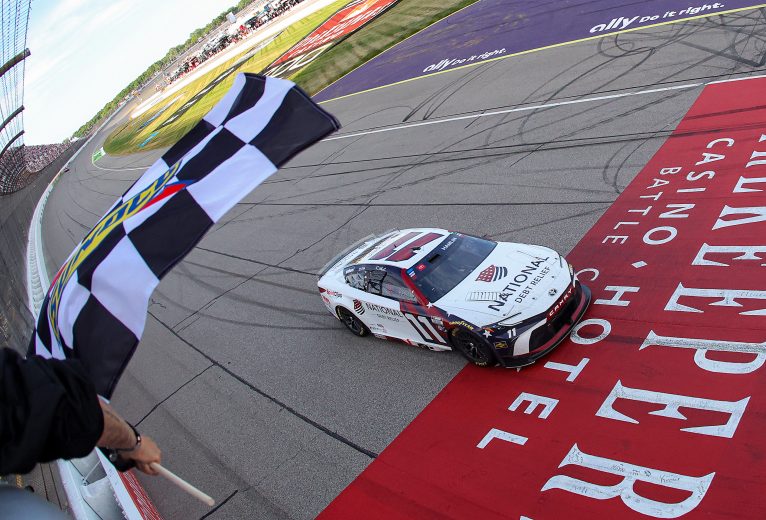 Denny Hamlin takes checkered flag at Michigan.