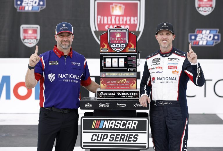 Denny Hamlin and crew chief Chris Gayle in Michigan Victory Lane.