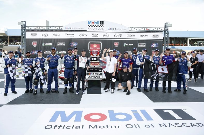 Denny Hamlin and team in Michigan Victory Lane.