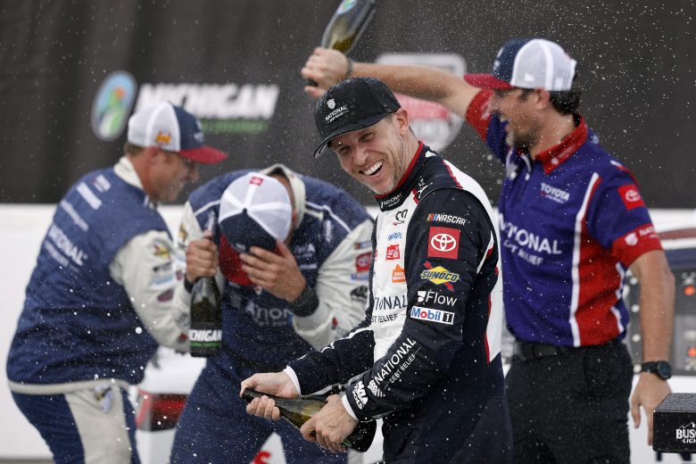 Denny Hamlin and team in Michigan Victory Lane.