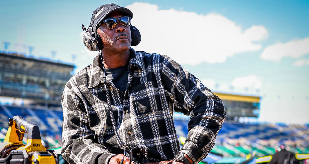 Michael Jordan, co-owner of 23XI Racing, looks on at a NASCAR race.