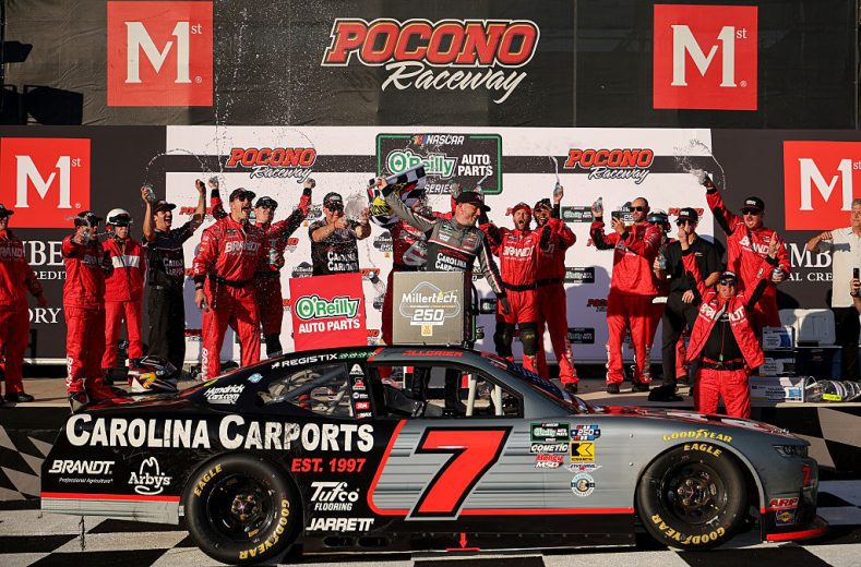 Justin Allgaier celebrates in Victory Lane after winning at Pocono.