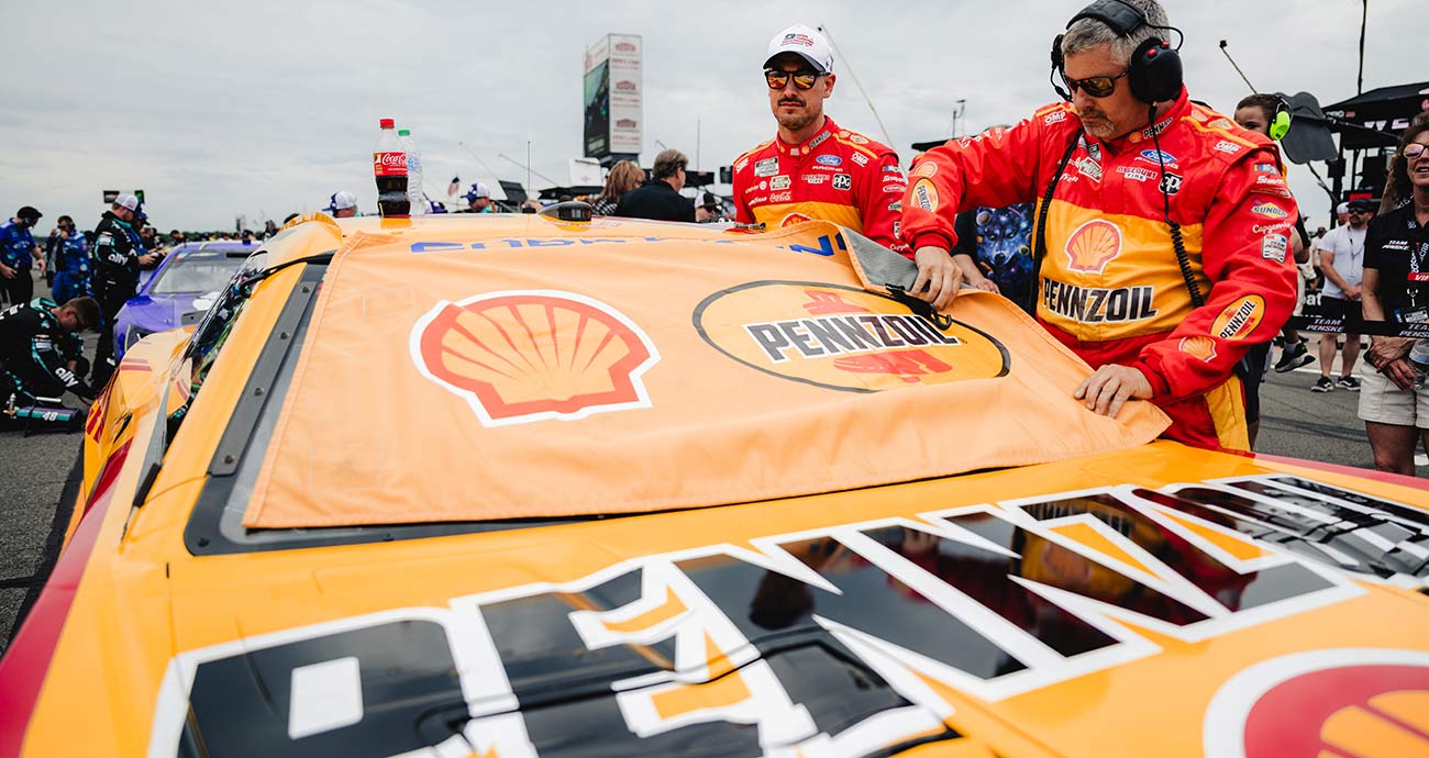 Joey Logano loads into his No. 22 Ford on pit road at Pocono Raceway