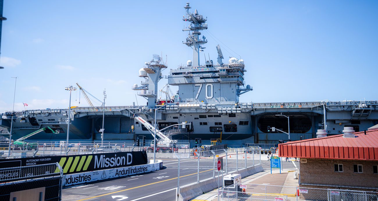 The USS Carl Vinson sits at the base of Turn 3 on the Naval Base Coronado NASCAR Course.