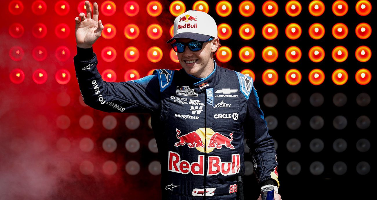 Connor Zilisch waves to the crowd before a NASCAR Cup Series race.