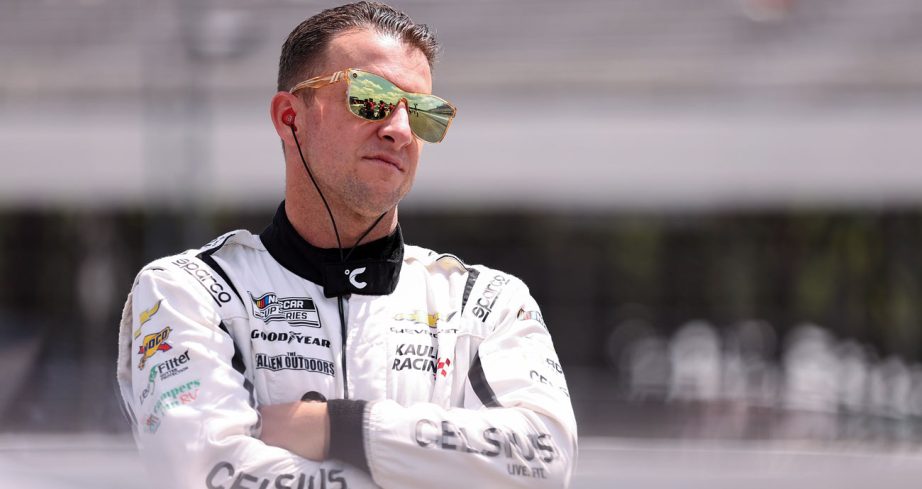AJ Allmendinger looks on before a NASCAR Cup Series race with Kaulig Racing.