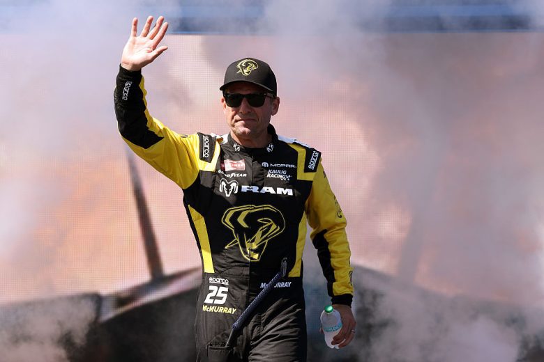 Jamie McMurray waves to fans.