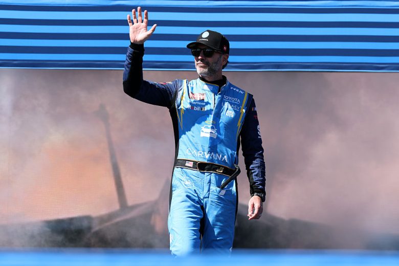 Jimmie Johnson waves to fans.