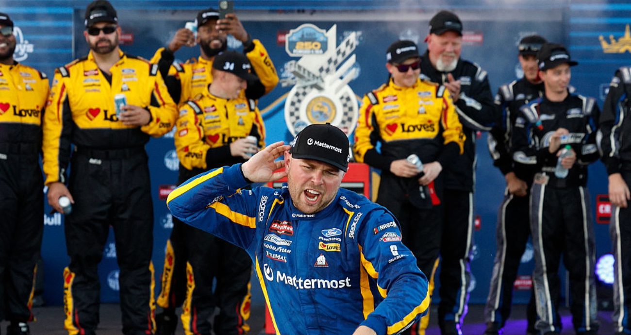 Layne Riggs celebrates in Victory Lane at Naval Base Coronado.