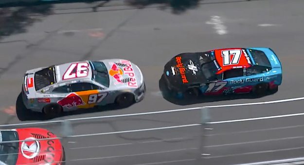 Buescher backwards as field narrowly avoids contact