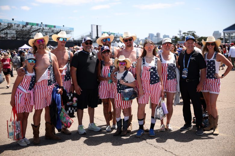 NASCAR fans pose for photos before the Cup Series Anduril 250 at Naval Base Coronado.