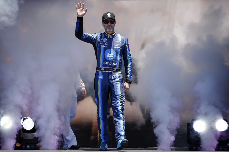 Jimmie Johnson walks the stage.