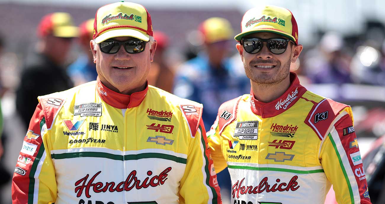 Kyle Larson, right, and NASCAR Hall of Famer Terry Labonte pose for photos before the Goodyear 400 at Darlington Raceway in 2024