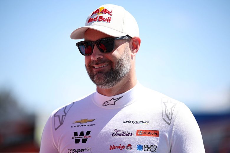 Shane van Gisbergen looks on.