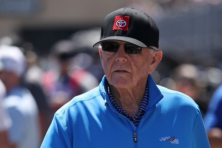 Joe Gibbs looks on.