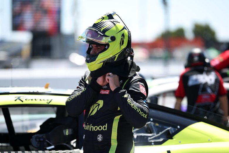 Bubba Wallace looks on.