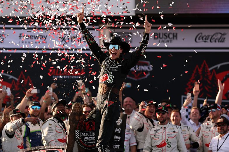 Carson Hocevar celebrates in Victory Lane.