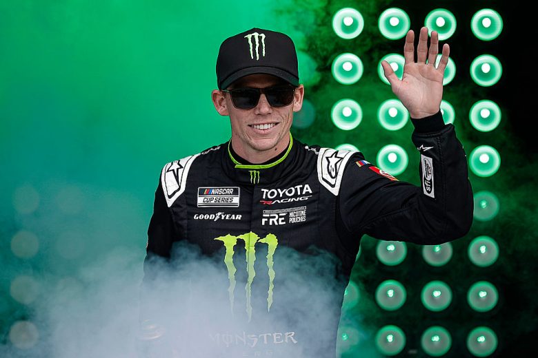 Riley Herbst waves to the crowd before a NASCAR Cup Series race.