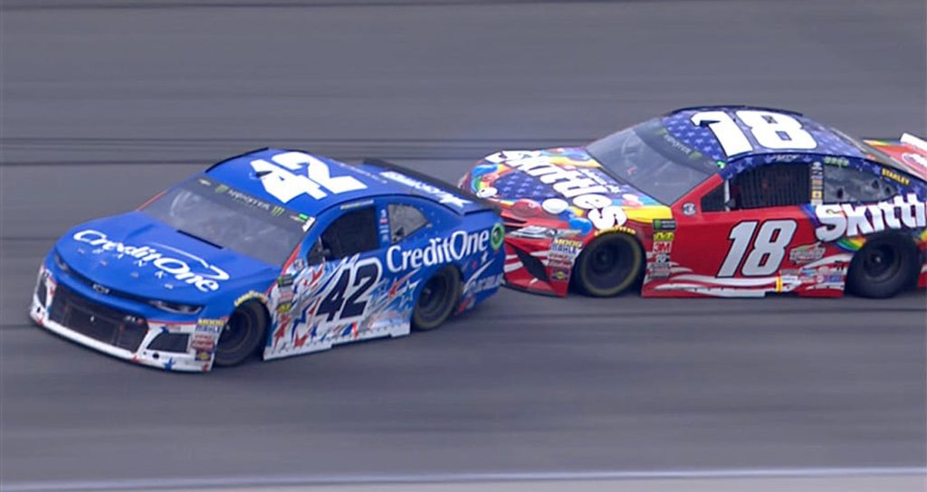 Kyle Busch in the No. 18 Toyota makes contact with Kyle Larson in the No. 42 Chevrolet during the NASCAR Cup Series race in 2018 at Chicagoland Speedway.
