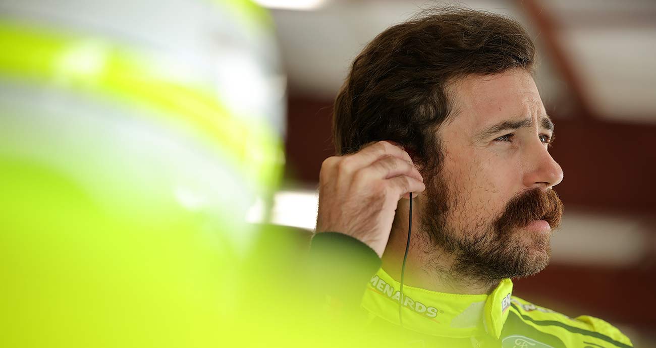 Ryan Blaney suits up for practice runs in the Cup Series garage at Chicagoland Speedway.