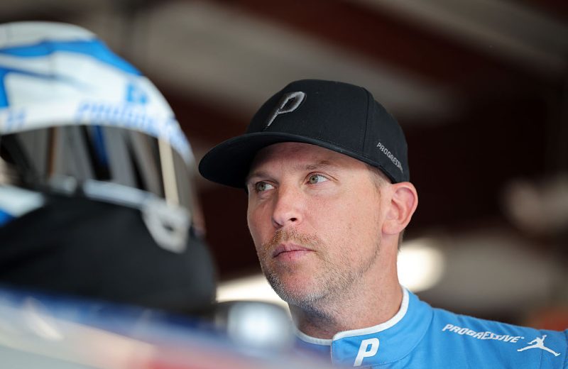 Denny Hamlin looks on.
