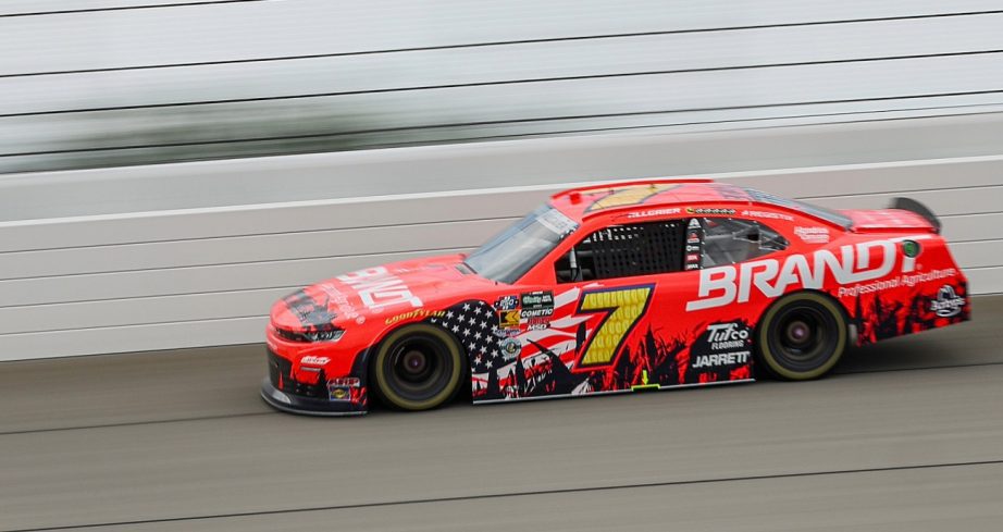 Cars drive at Chicagoland Speedway.