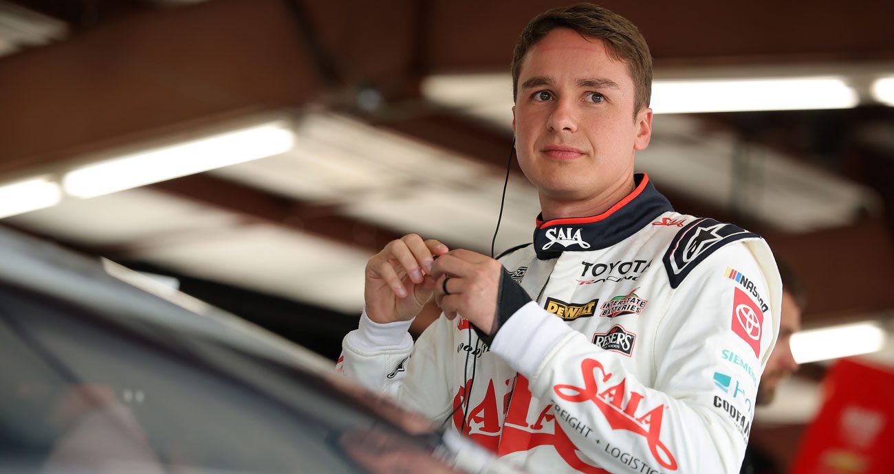 Christopher Bell stands next to his car at Chicagoland.