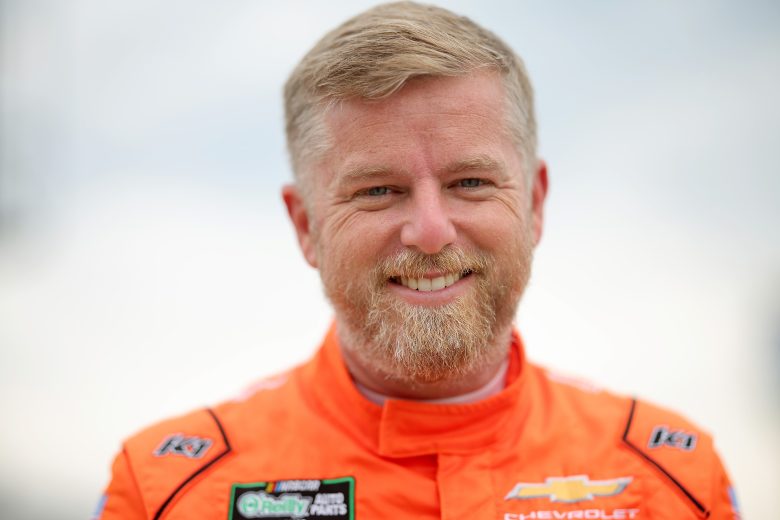 Justin Allgaier looks on and smiles.