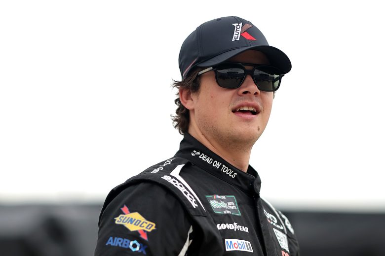 Harrison Burton loooks on.