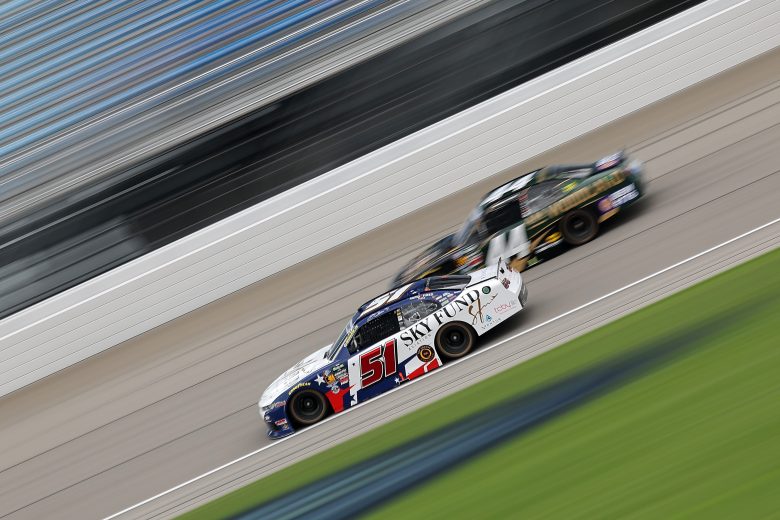 Cars drive at Chicagoland Speedway.