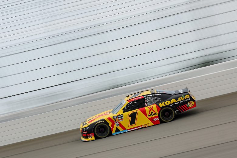 Cars drive at Chicagoland Speedway.