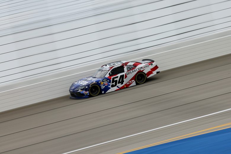 Cars drive at Chicagoland Speedway.