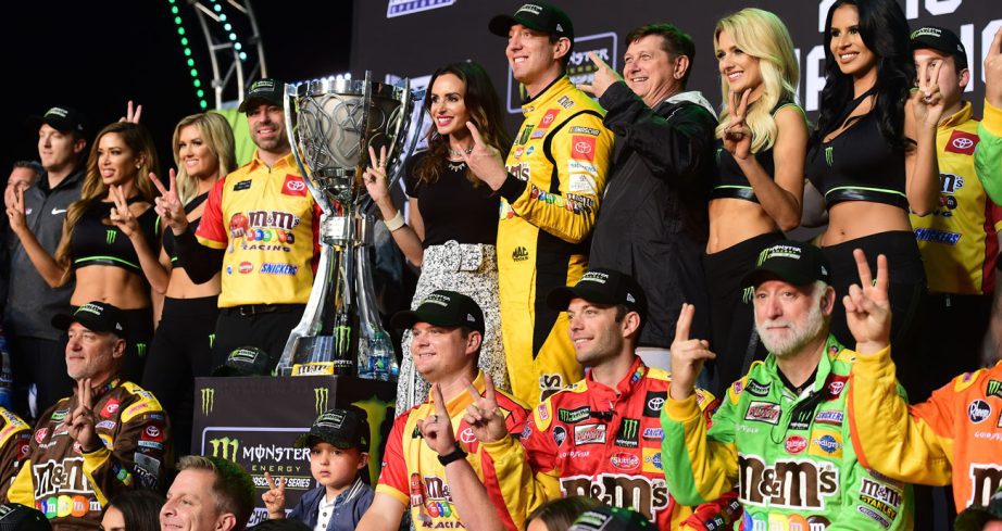 Kyle Busch poses for a photo in Victory Lane at Homestead-Miami Speedway.