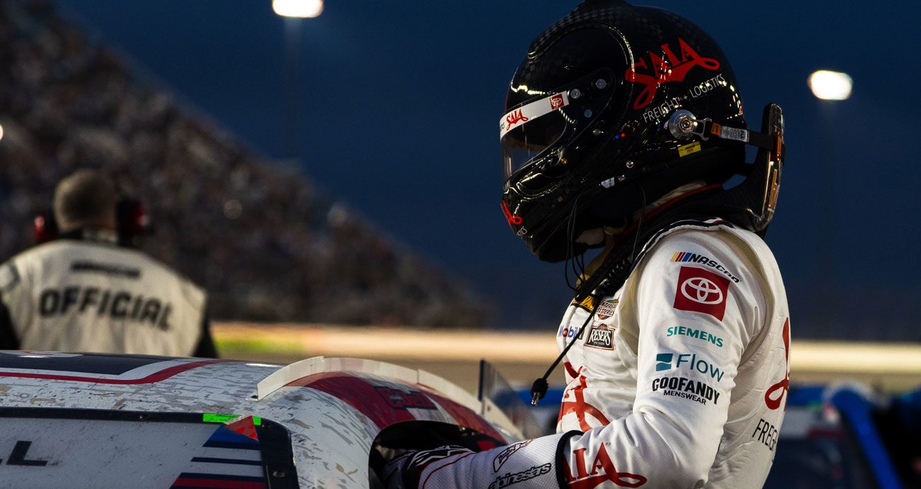 Christopher Bell climbs from his No. 20 car after a NASCAR Cup Series race at Chicagoland.