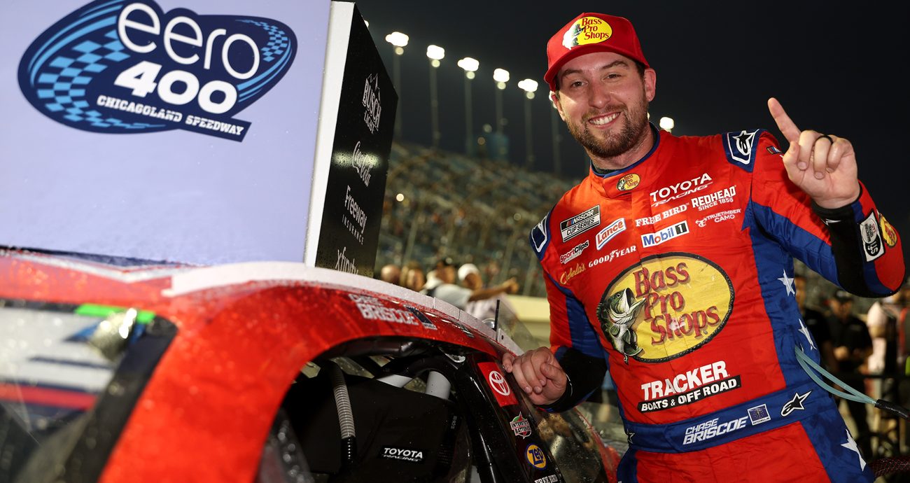 Chase Briscoe signals No. 1 with his finger after placing the winner sticker on his No. 19 Toyota at Chicagoland.