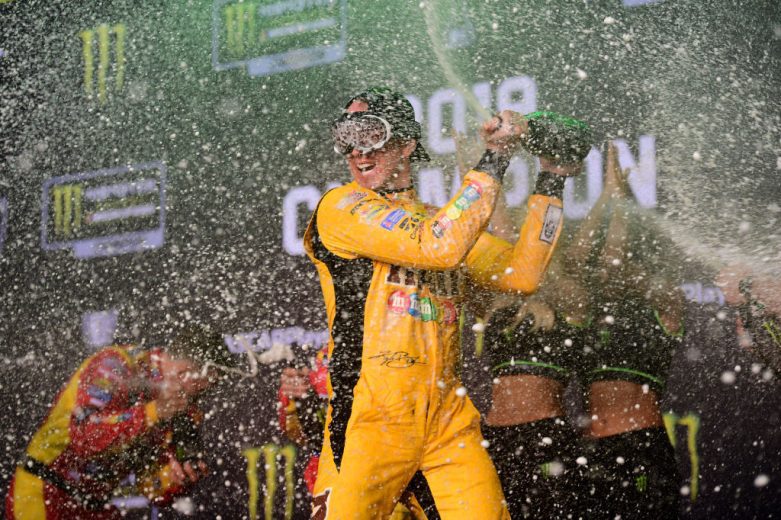 Kyle Busch celebrates in Victory Lane.
