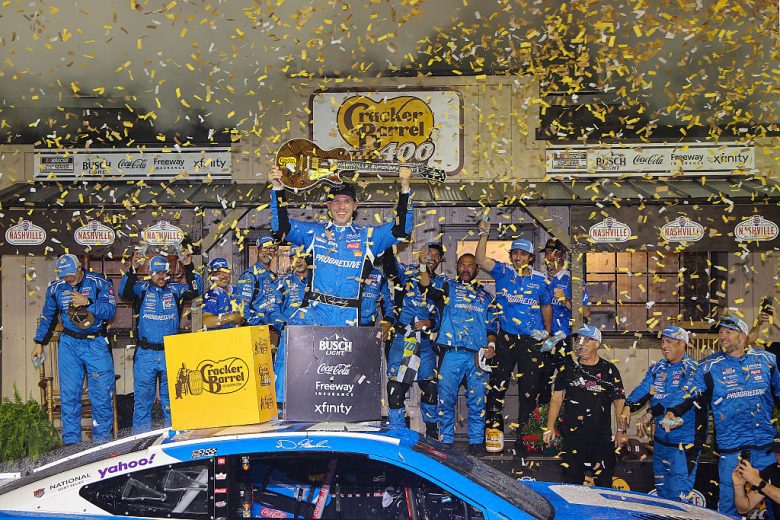 Denny Hamlin celebrates in Victory Lane.