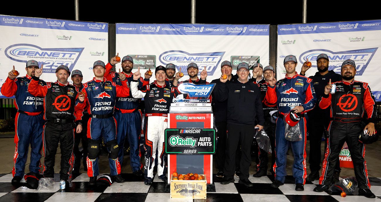Sheldon Creed poses for a photo in Victory Lane with his team at EchoPark Speedway.