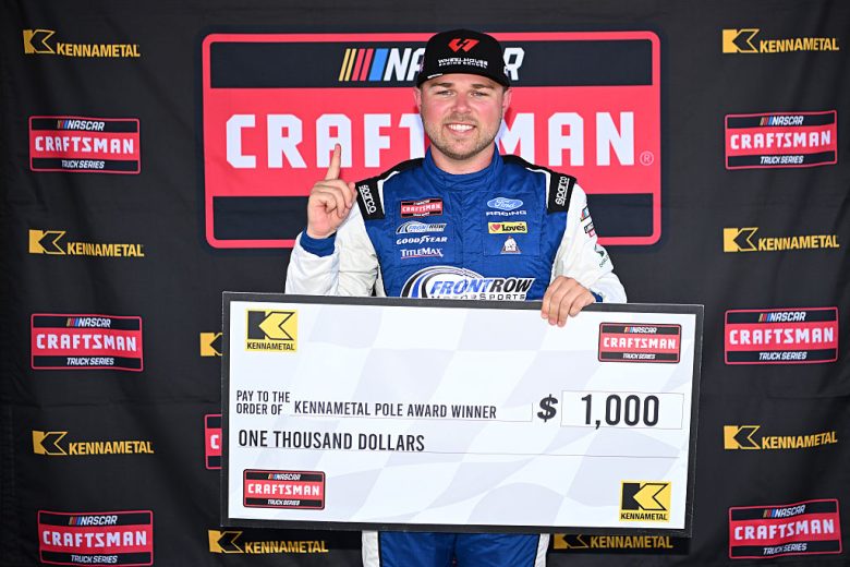 Layne Riggs celebrates after winning the pole at Lime Rock.