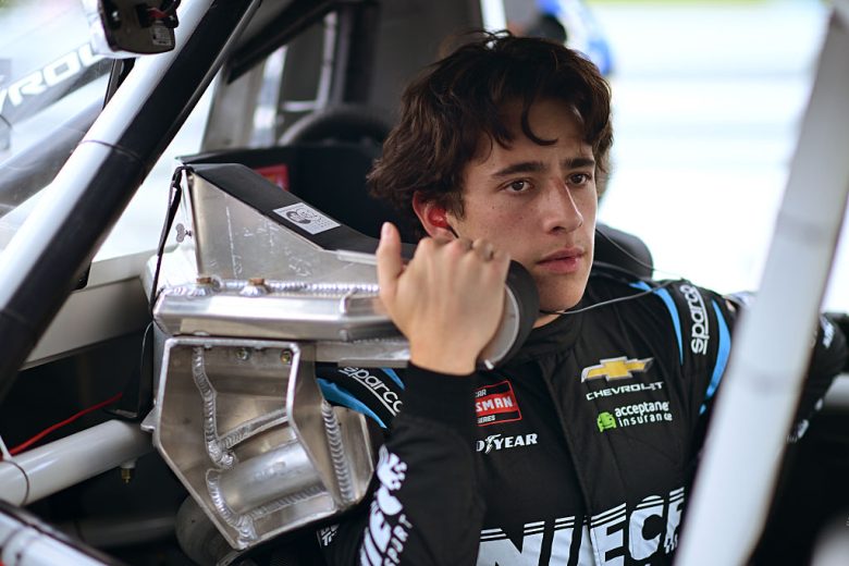 Andrés Pérez looks on.