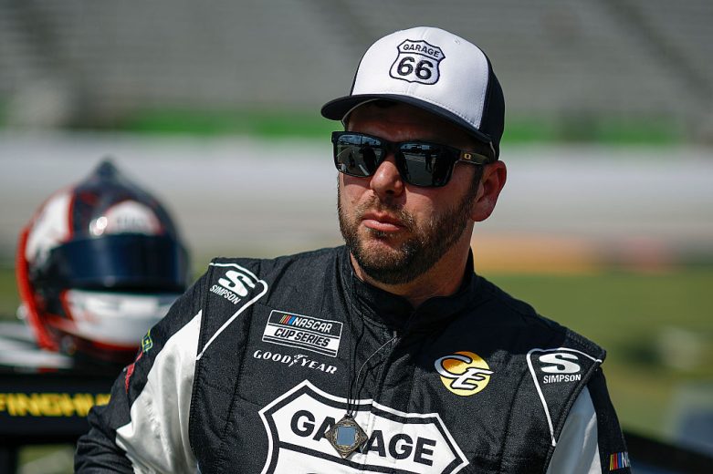 Chad Finchum looks on.