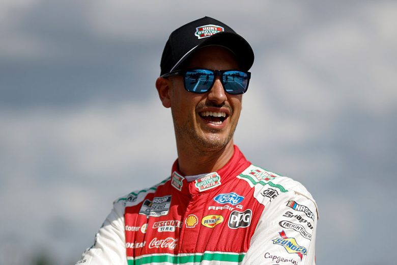 Joey Logano looks on.