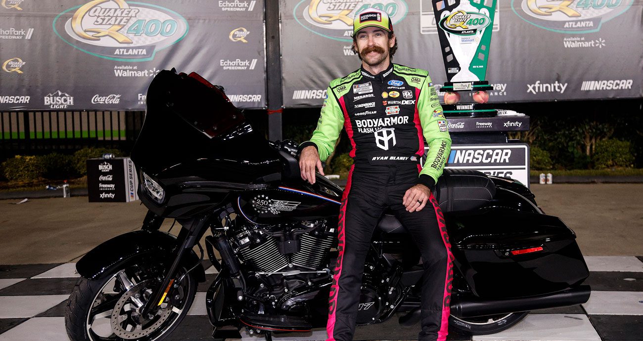 Ryan Blaney poses for a photo in Victory Lane at EchoPark Speedway.