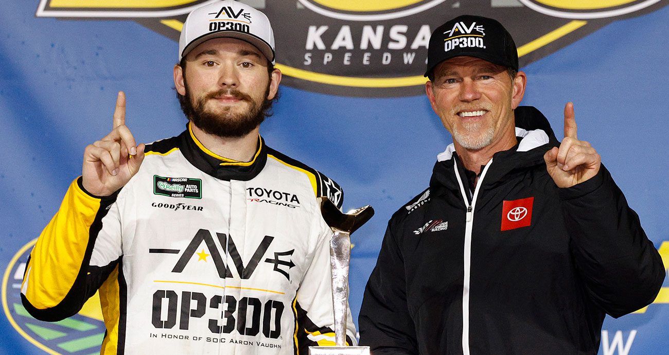 Taylor Gray (L) and Jason Ratcliff (R) pose for a photo in Victory Lane at Kansas Speedway.