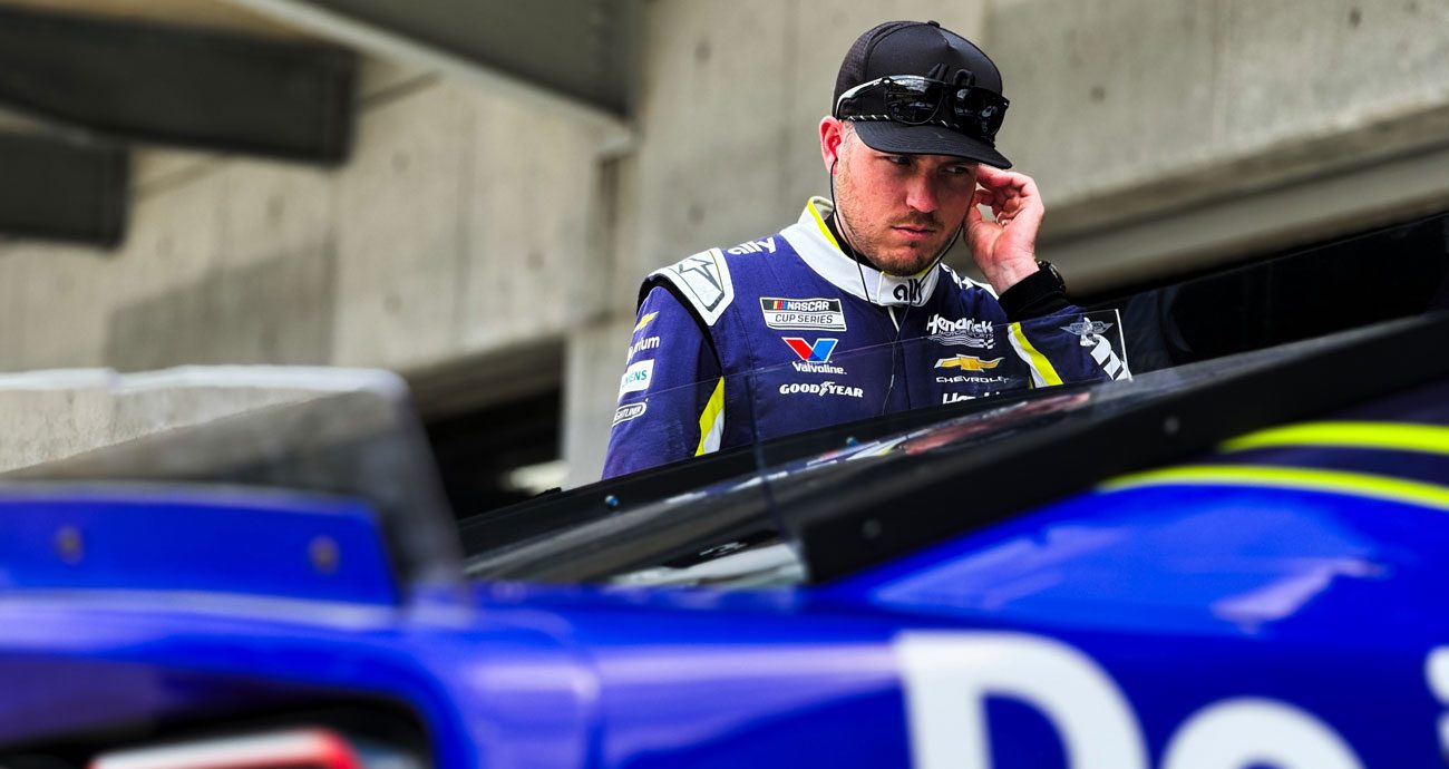 Alex Bowman looks on in the Indianapolis garage.