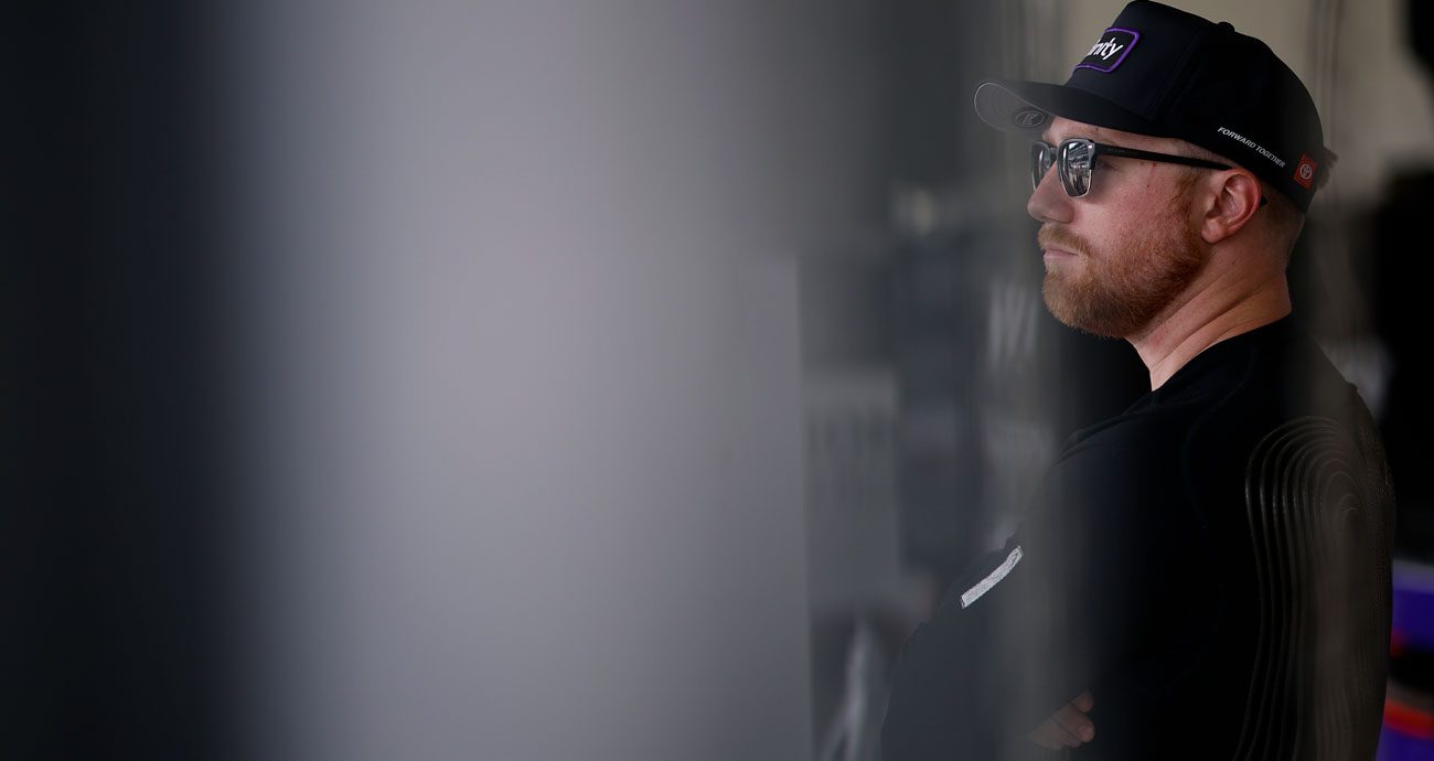 Tyler Reddick looks on.