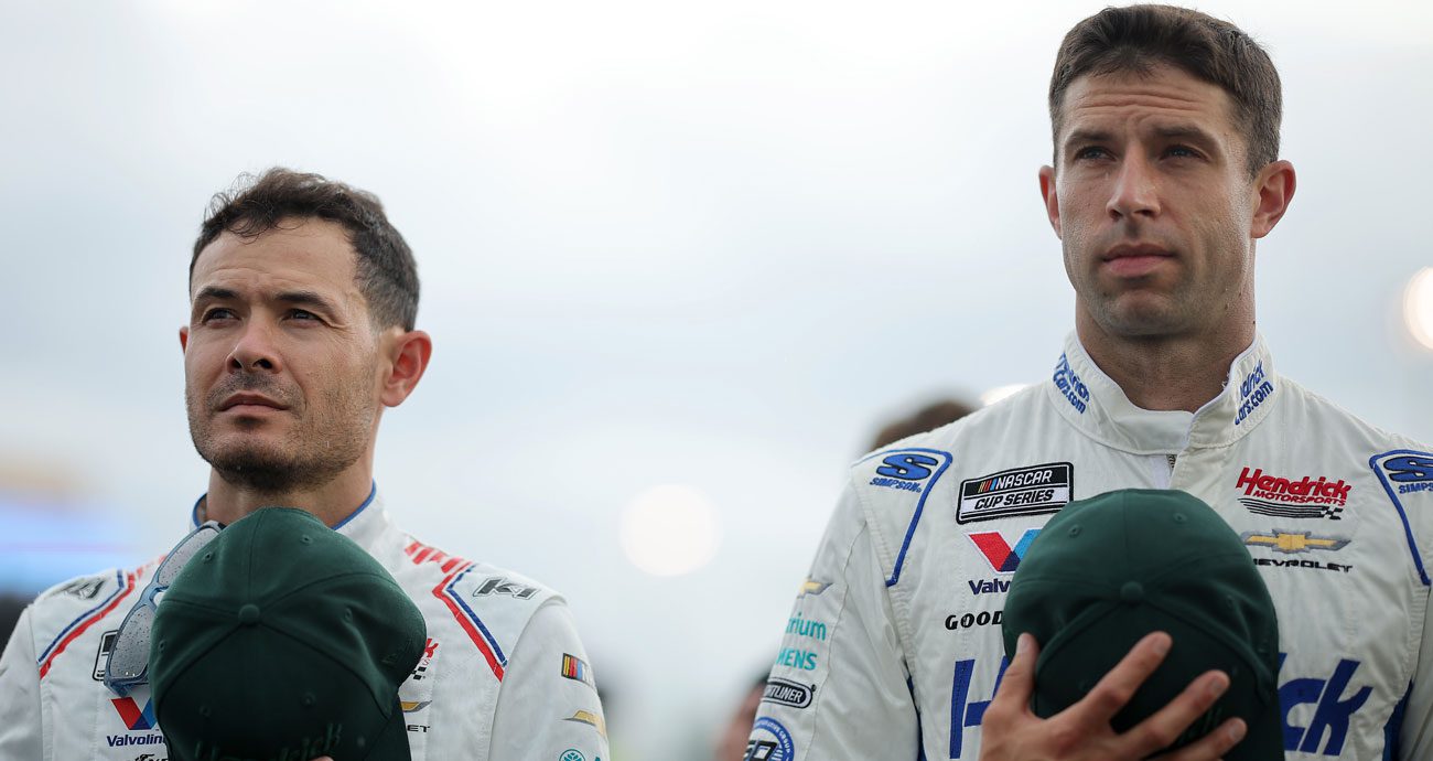 Kyle Larson and crew chief Cliff Daniels look on before a NASCAR Cup Series race.