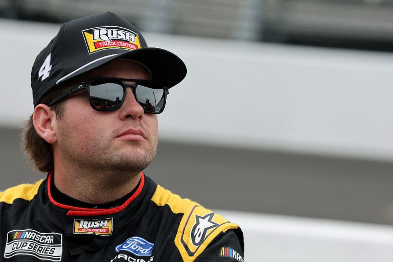 Noah Gragson looks on.