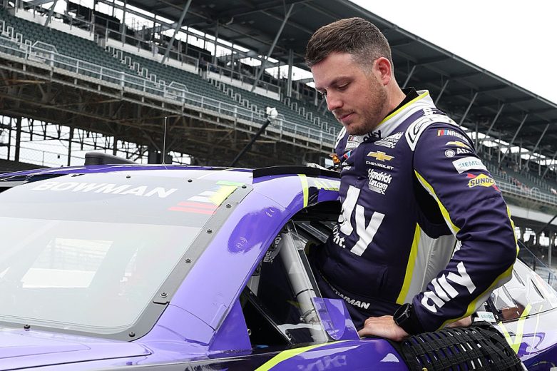Alex Bowman enters his car at Indianapolis.